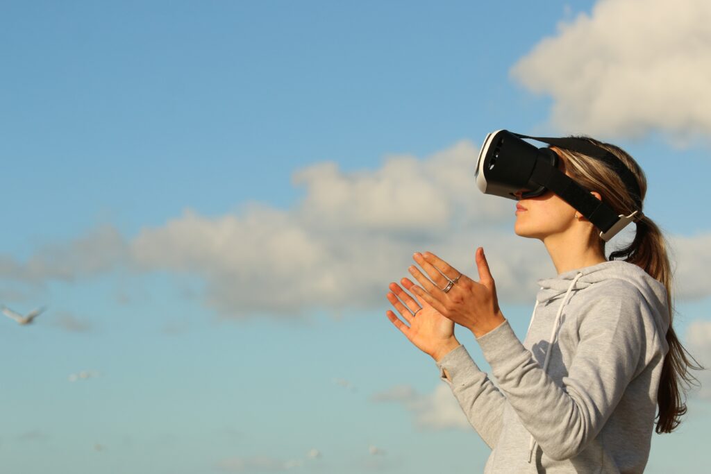 woman using virtual reality goggles outdoors
