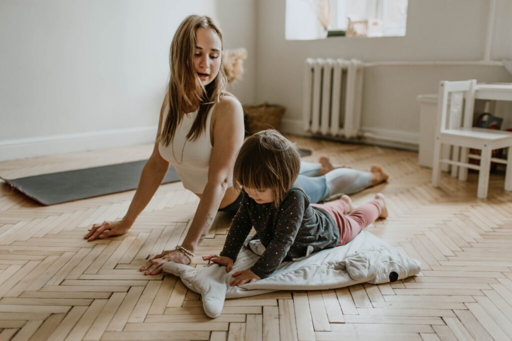 busy mom exercising with child